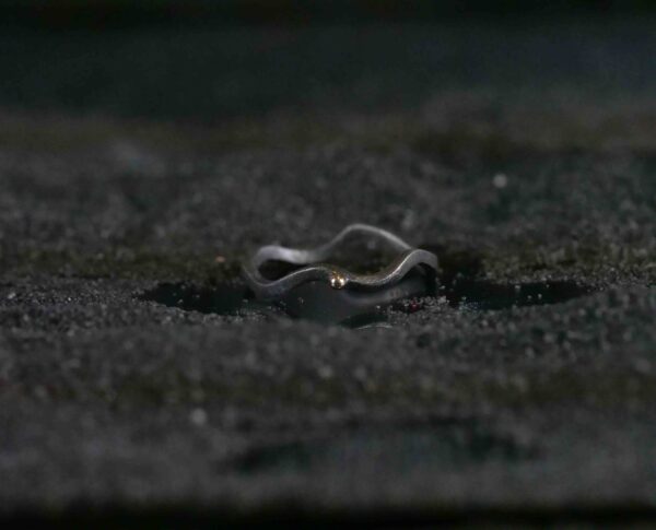 Oxidised silver ring with gold drop